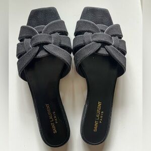 SAINT LAURENT Tribute sandal slides in black jeans